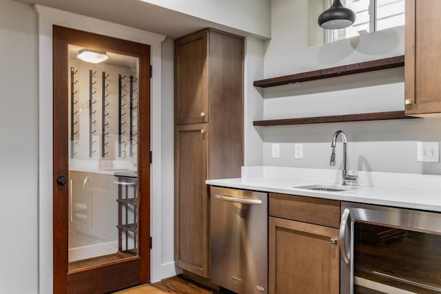 1038 Saint Charles Ave, Atlanta, GA 30306 - bar with wine cooler, stainless steel dishwasher, a sink, and light wood-style flooring