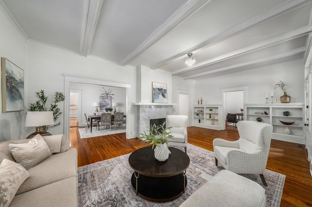 1038 Saint Charles Ave, Atlanta, GA 30306 - living area with beamed ceiling, wood finished floors, a fireplace, and ornamental molding