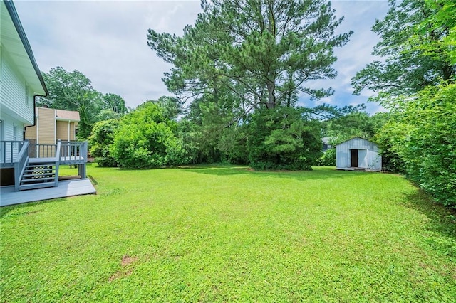4732 Manly Ct, Stone Mountain, GA 30088 - view of grassy yard featuring a wooden deck and view of wooded area