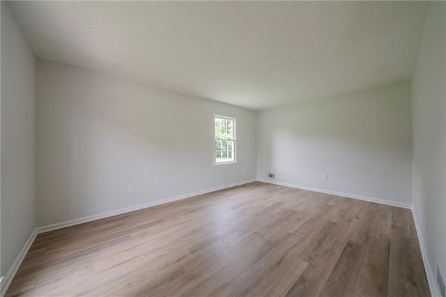 4732 Manly Ct, Stone Mountain, GA 30088 - spare room with wood finished floors and baseboards
