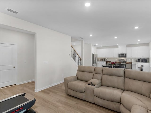 living room with light hardwood / wood-style flooring