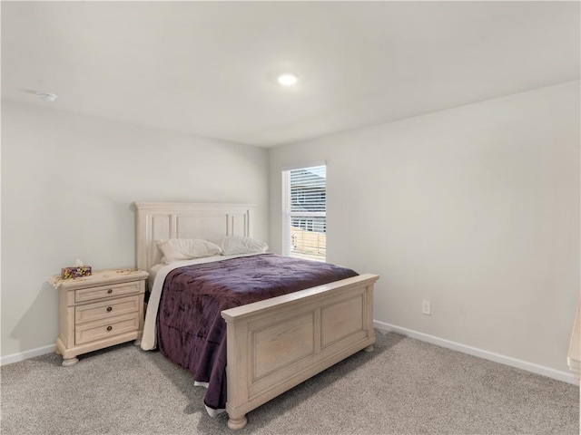 bedroom featuring light carpet