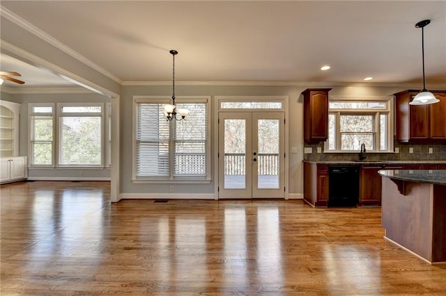 bedroom featuring a raised ceiling and light colored carpet