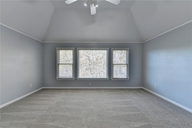 unfurnished room with ceiling fan, light colored carpet, and vaulted ceiling