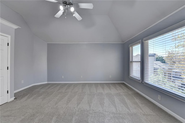 bonus room featuring light colored carpet, plenty of natural light, lofted ceiling, and ceiling fan