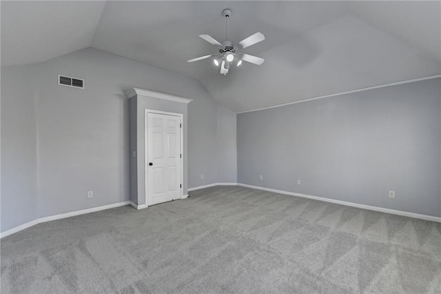 additional living space featuring light colored carpet, ceiling fan, and lofted ceiling