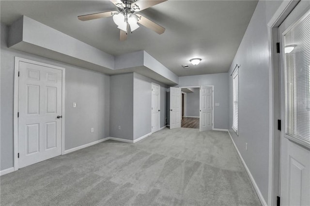 interior space featuring ceiling fan