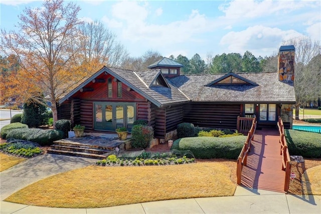 log cabin featuring french doors