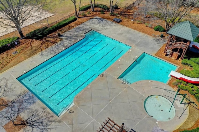 view of pool featuring a gazebo and a water slide