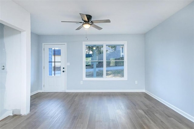 spare room with ceiling fan and hardwood / wood-style flooring