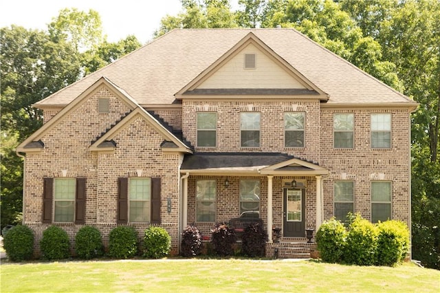 305 Anise Ct, Mcdonough, GA 30252 - craftsman-style house with a front yard, brick siding, and a shingled roof