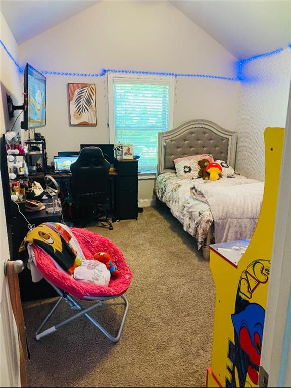 305 Anise Ct, Mcdonough, GA 30252 - bedroom with carpet flooring and lofted ceiling