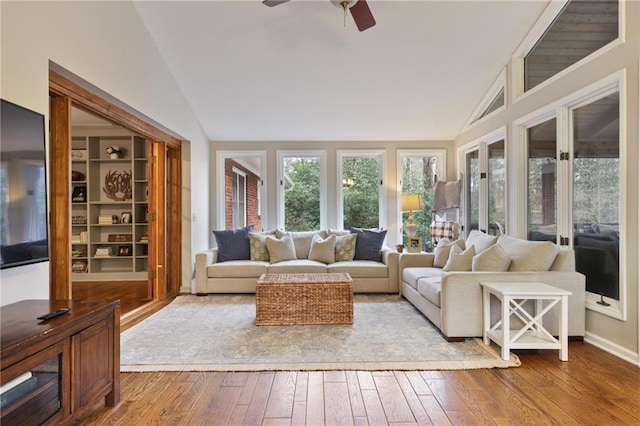 sunroom / solarium featuring vaulted ceiling and ceiling fan