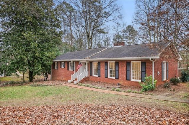 ranch-style home with a front lawn