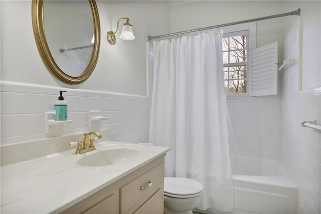 full bathroom featuring vanity, shower / bath combination with curtain, toilet, and tile walls