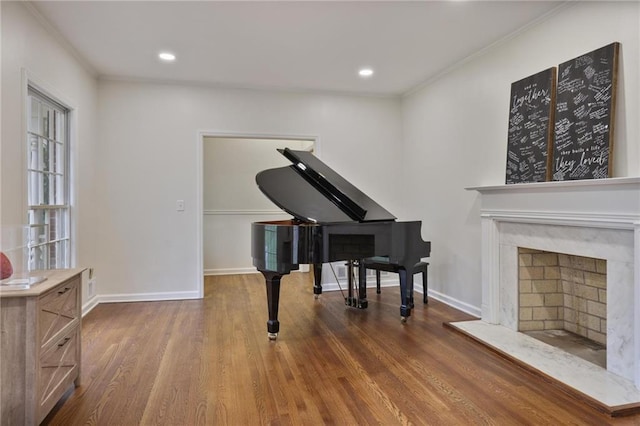 miscellaneous room with crown molding and wood-type flooring