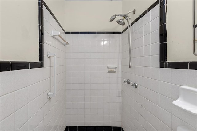 bathroom with a tile shower