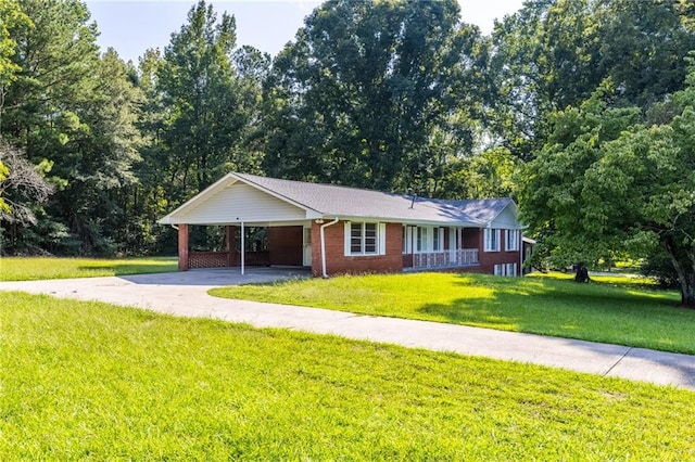 single story home featuring an attached carport, concrete driveway, brick siding, and a front lawn