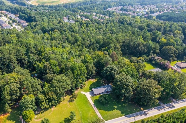 aerial view featuring a wooded view