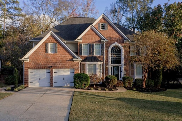 view of front of house featuring a front yard and a garage