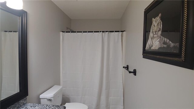 2477 Briar Valley Way, Dacula, GA 30019 - bathroom featuring toilet and a shower with shower curtain