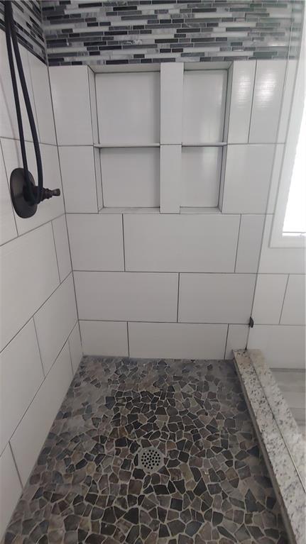 2477 Briar Valley Way, Dacula, GA 30019 - full bath with stone floors and a tile shower