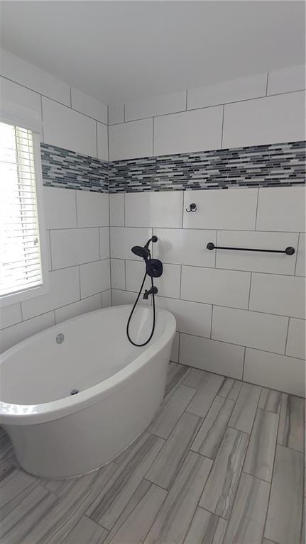 2477 Briar Valley Way, Dacula, GA 30019 - full bathroom featuring a freestanding bath