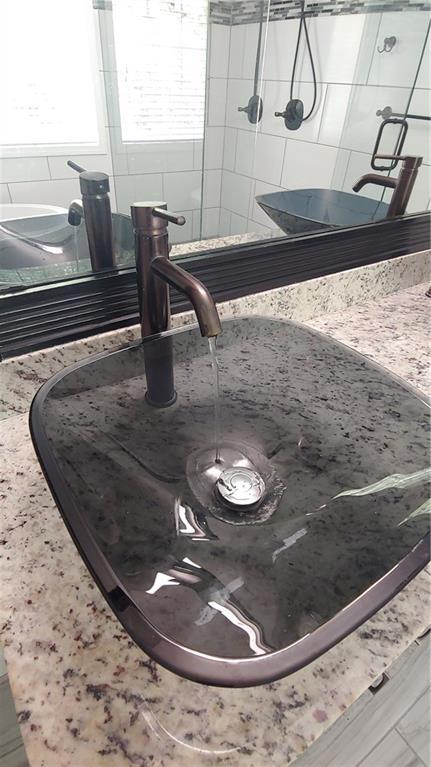 2477 Briar Valley Way, Dacula, GA 30019 - interior details featuring a sink and tasteful backsplash