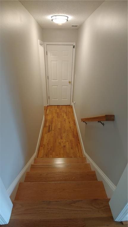 2477 Briar Valley Way, Dacula, GA 30019 - staircase featuring baseboards and wood finished floors