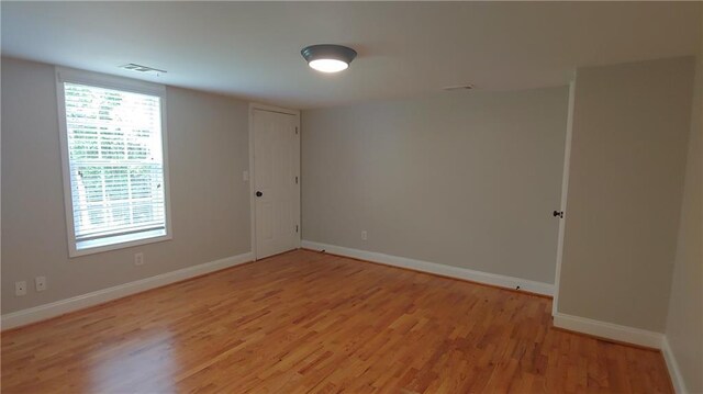 2477 Briar Valley Way, Dacula, GA 30019 - spare room featuring baseboards, visible vents, and light wood-style floors
