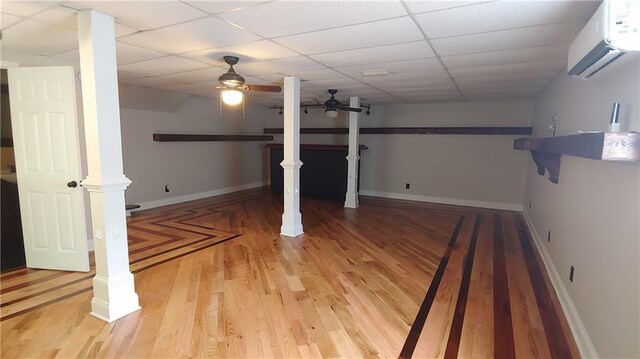 2477 Briar Valley Way, Dacula, GA 30019 - basement featuring an AC wall unit, ceiling fan, baseboards, and light wood-style floors