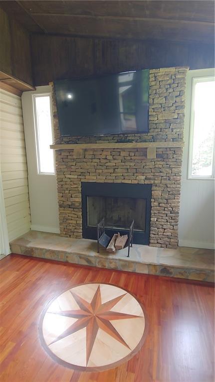 2477 Briar Valley Way, Dacula, GA 30019 - interior details featuring baseboards, wood finished floors, and a fireplace