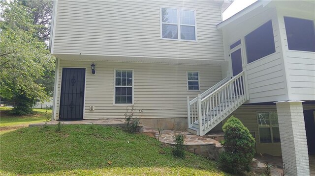 2477 Briar Valley Way, Dacula, GA 30019 - rear view of house with a lawn and stairs