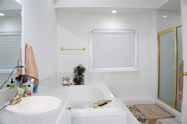 bathroom featuring vanity, tile patterned floors, and plus walk in shower