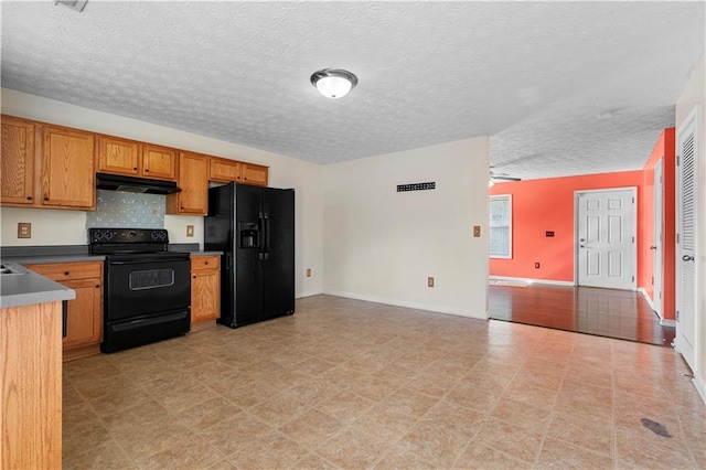 kitchen with black appliances, a textured ceiling, and ceiling fan