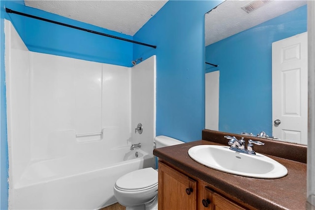 full bathroom featuring shower / bath combination, toilet, a textured ceiling, and vanity