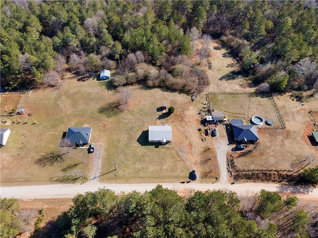 birds eye view of property with a rural view