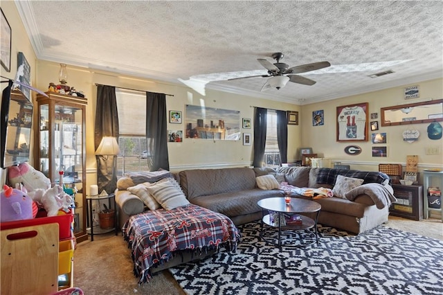 carpeted living area featuring ornamental molding, visible vents, a textured ceiling, and a ceiling fan