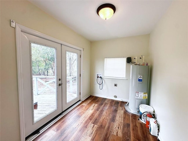 laundry area with hookup for a washing machine, wood finished floors, laundry area, water heater, and electric dryer hookup