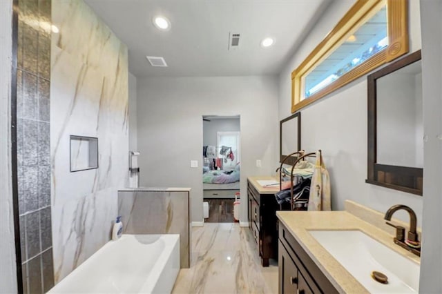 bathroom with vanity and a bathtub