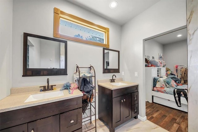 bathroom featuring vanity and hardwood / wood-style floors