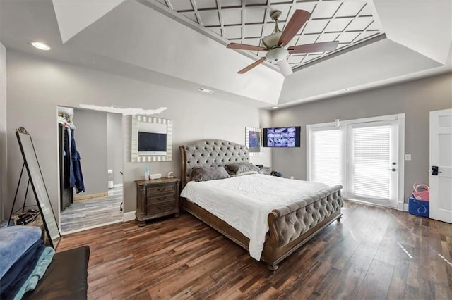 bedroom with dark hardwood / wood-style flooring, a closet, and ceiling fan