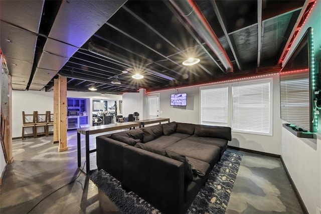 home theater featuring concrete floors