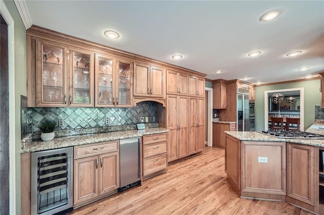 kitchen with crown molding, glass insert cabinets, appliances with stainless steel finishes, wine cooler, and backsplash