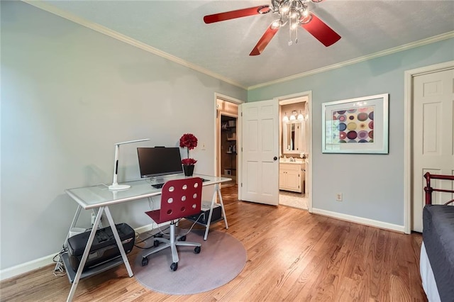 home office featuring ornamental molding, a ceiling fan, wood finished floors, and baseboards