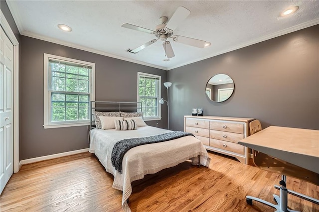 bedroom featuring baseboards, light wood-type flooring, multiple windows, and recessed lighting
