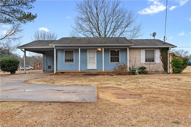 ranch-style house with a carport and a porch