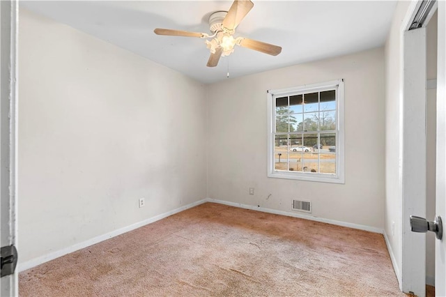 empty room featuring light carpet and ceiling fan