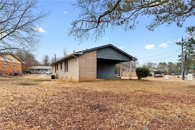 view of property exterior with a carport