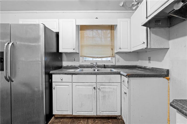 kitchen featuring sink, exhaust hood, white cabinets, and stainless steel refrigerator with ice dispenser